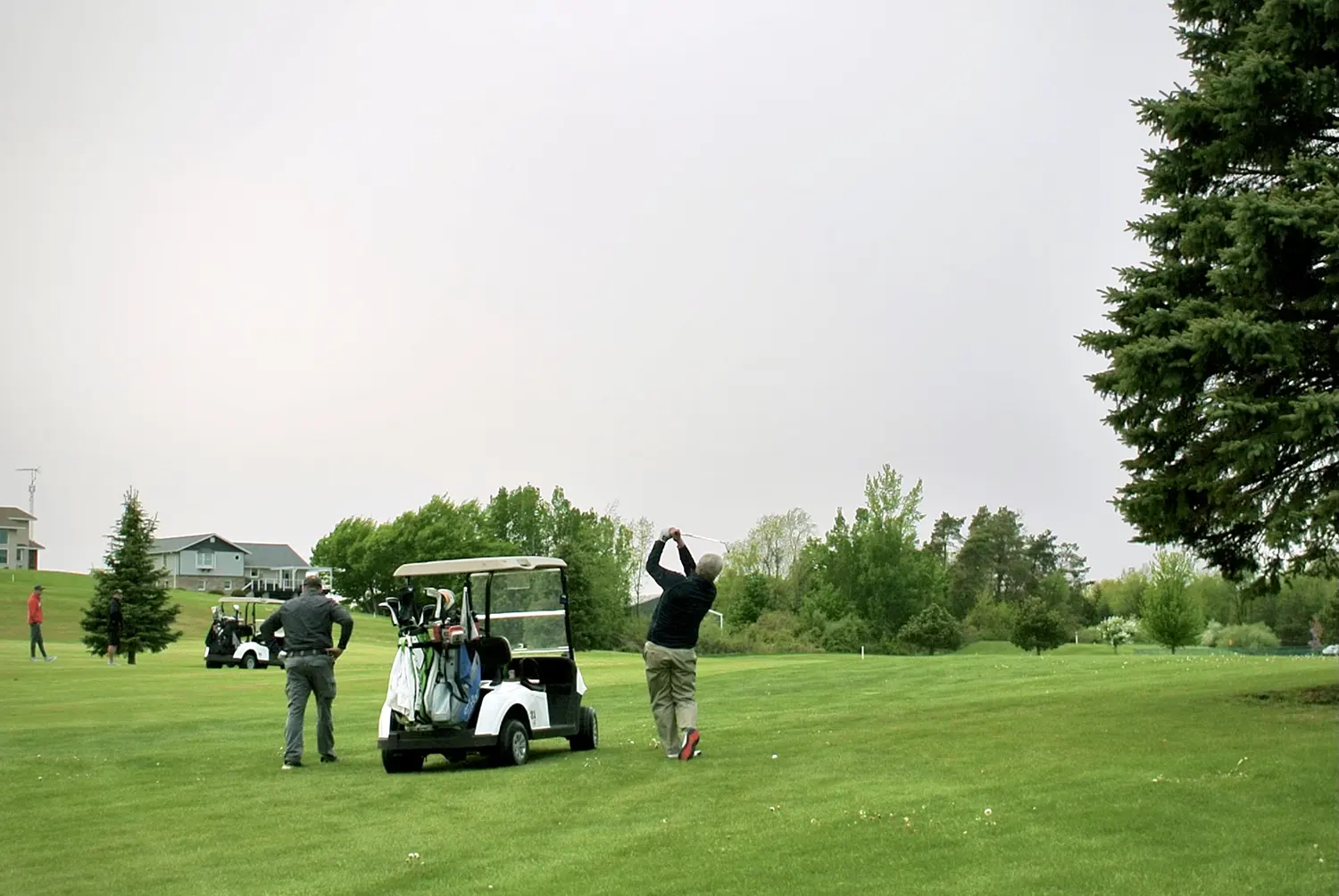 Golf Pro Scott Ashley hitting an approach at Lakeside Links in Ludington, MI